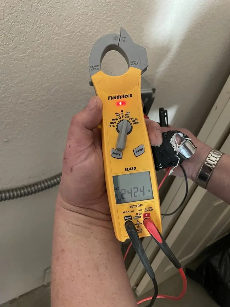 Voltage testing with clamp meter during Hot Tub / Pool Electrical Wiring in Springtown